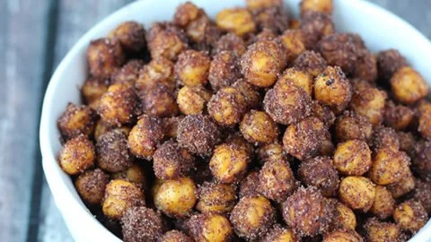 Bowl of cinnamon roasted chickpeas, a crunchy and healthy snack option.