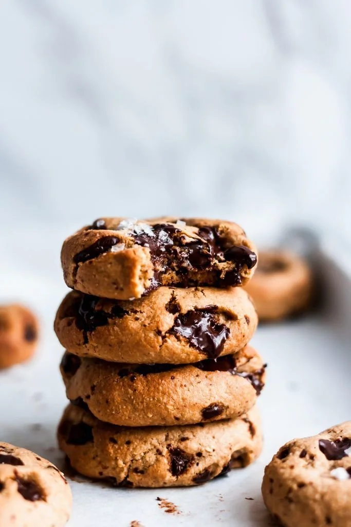 Paleo Tahini Chocolate Chunk Cookies on a wooden plate.