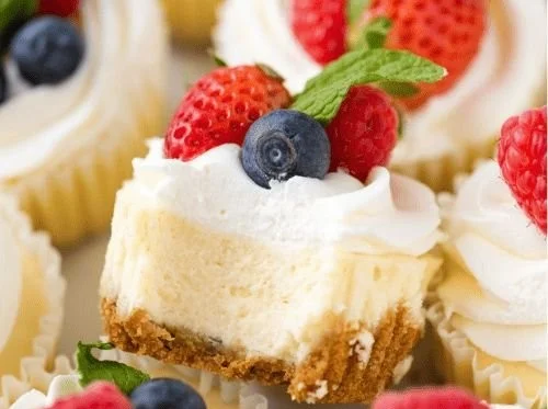 Delicious creamy mini cheesecakes served on a rustic wooden table