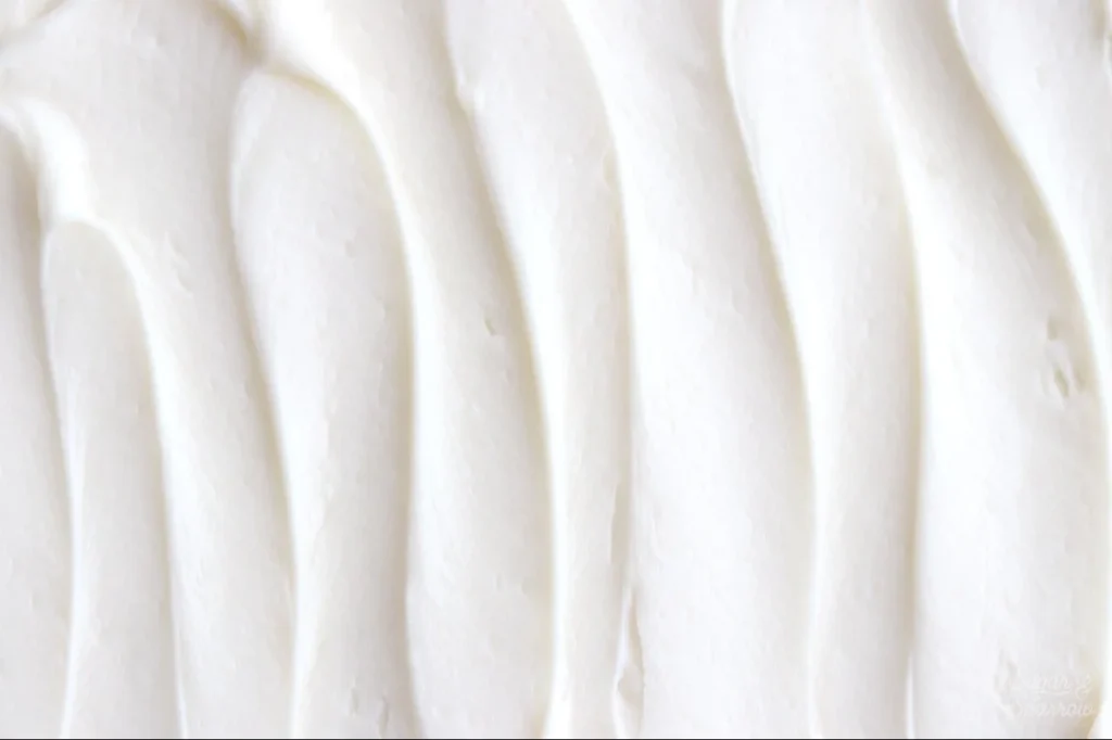 Delicious cream cheese buttercream frosting on a cake