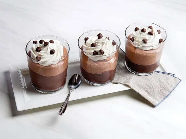 Elegant chocolate mousse layered parfait dessert in a glass