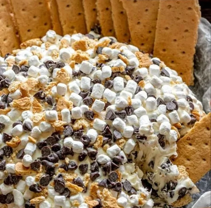 Decadent S'mores Cheeseball topped with chocolate and marshmallows