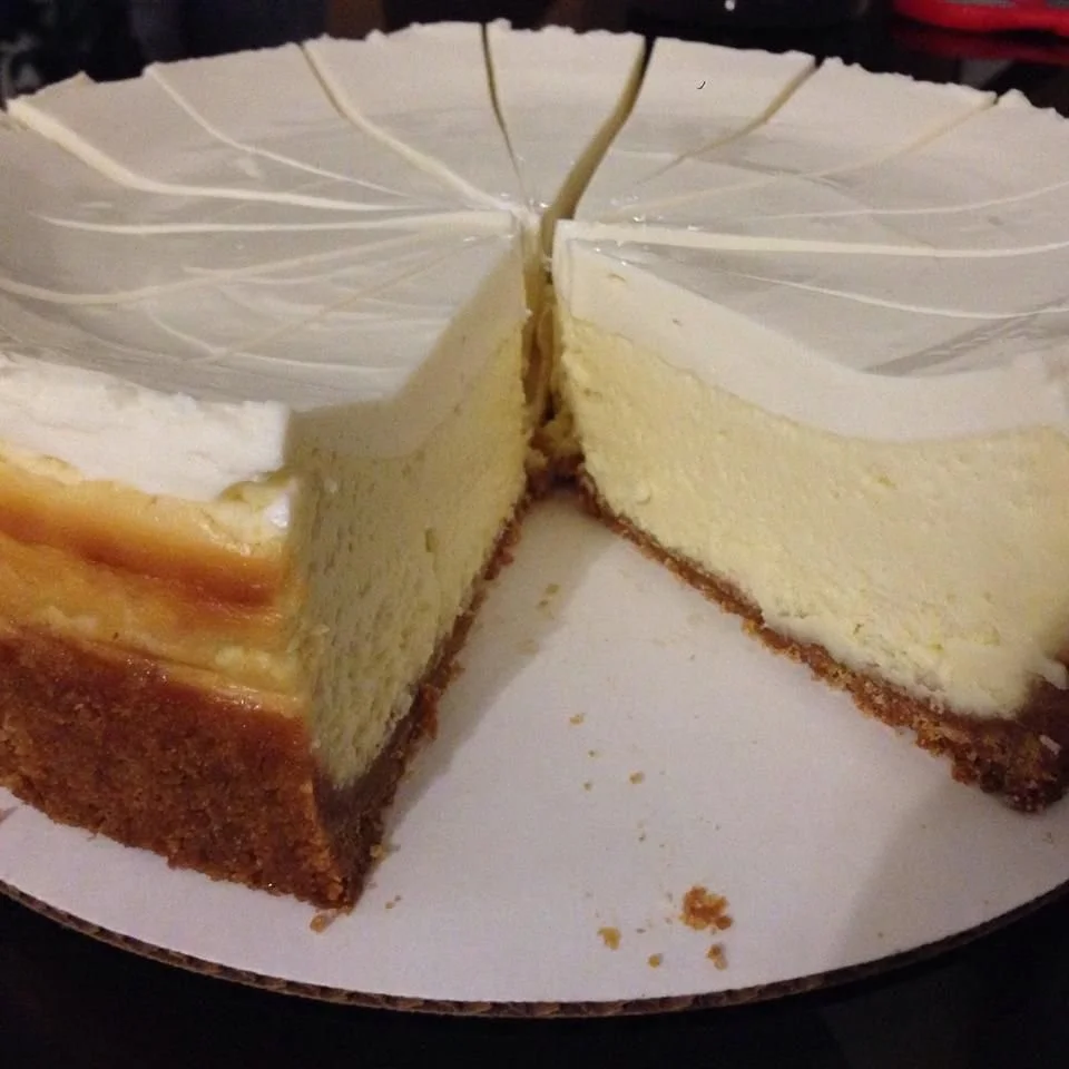 Slice of homemade classic New York Cheesecake on a plate