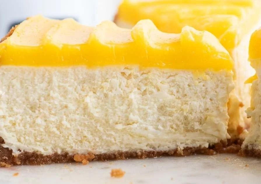 Easy Lemon Cheesecake Recipe 4 Delicious easy lemon cheesecake topped with fresh lemon slices and whipped cream