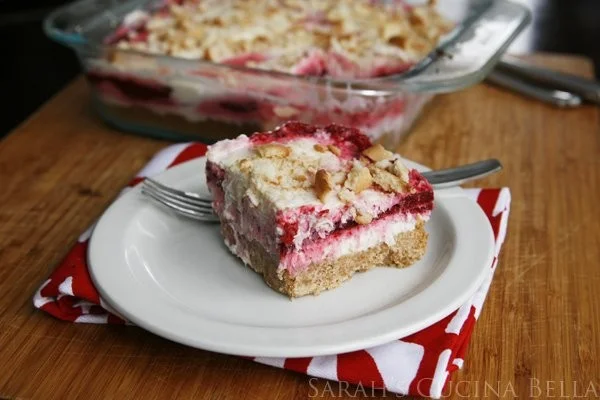 Easy raspberry swirl cheesecake garnished with fresh raspberries