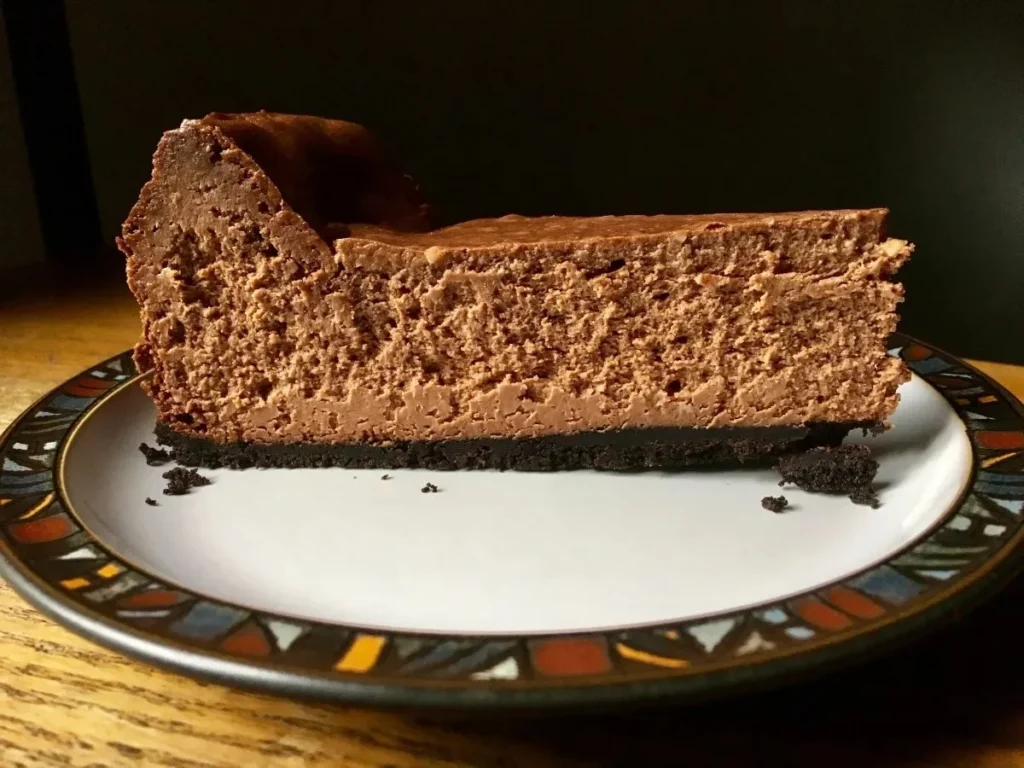 Deliciously rich chocolate cheesecake slice on a plate